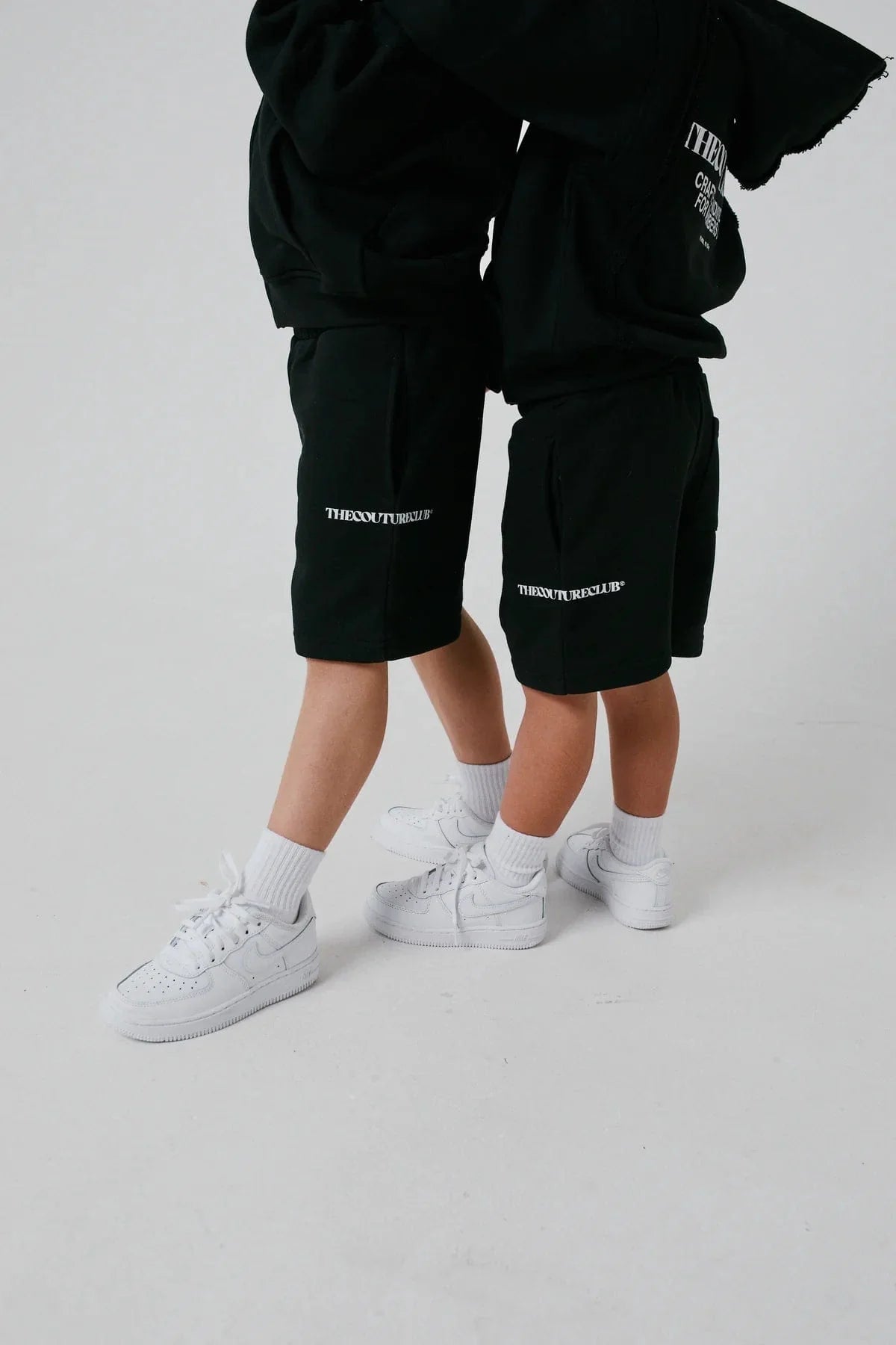 The Couture Club Kids Raw Seam Shorts in Black