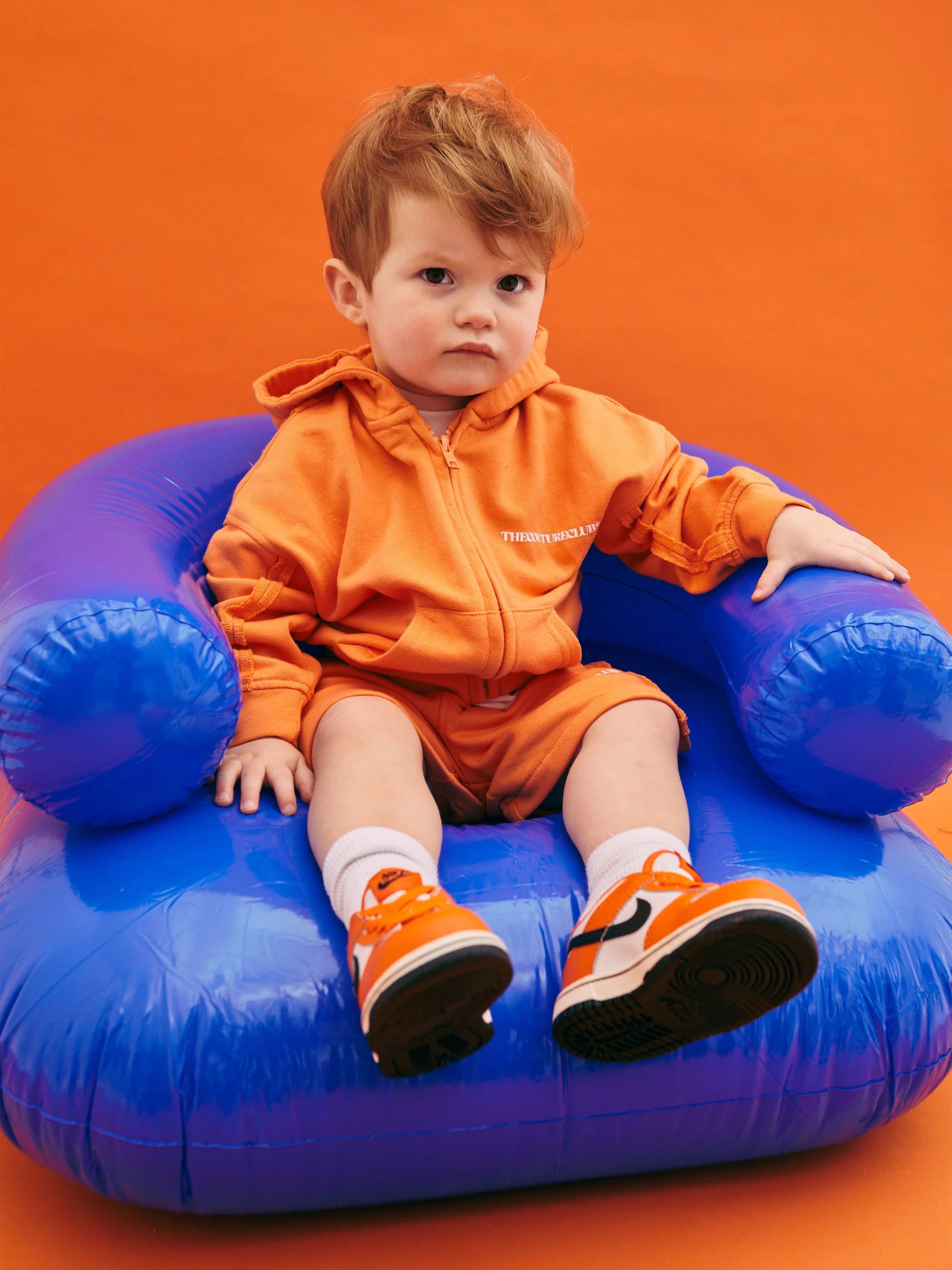 The Couture Club Kids Raw Seam Members Only Zip Up in Orange