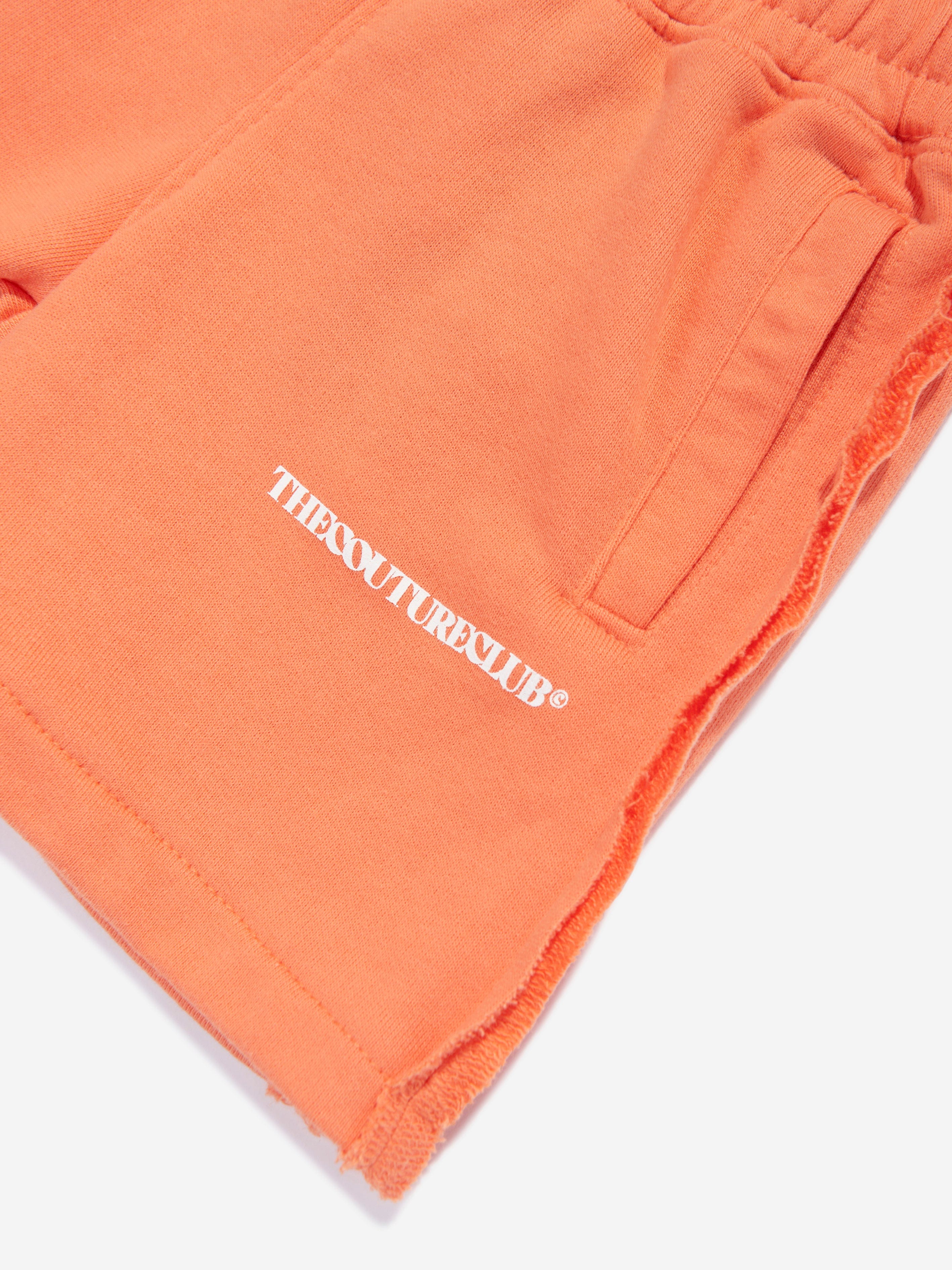 The Couture Club Kids Raw Seam Shorts in Orange